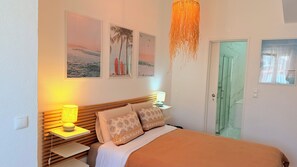 1 bedroom, desk, iron/ironing board, travel crib