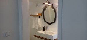 Shower, towels, soap, toilet paper
