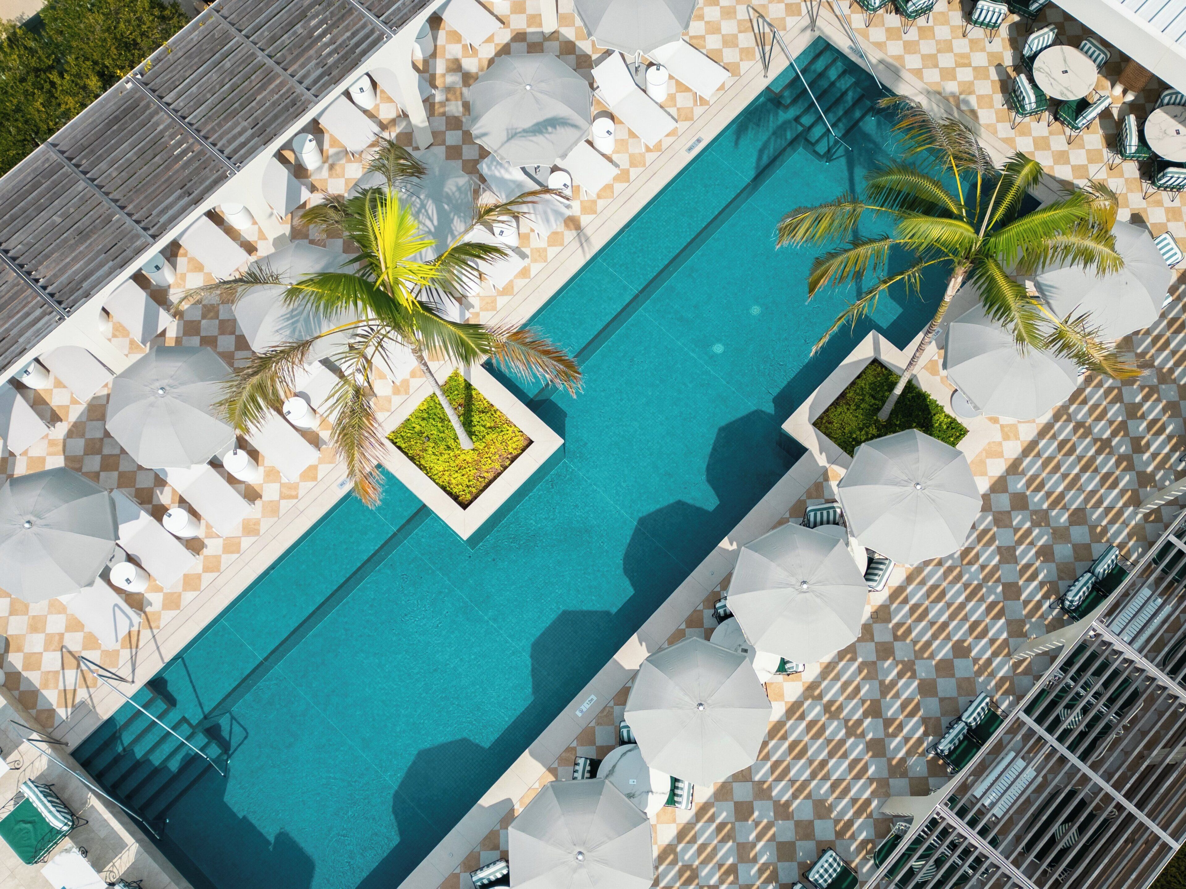 Outdoor pool, open 7:00 AM to 7:00 PM, free cabanas, pool umbrellas