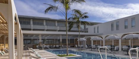 Outdoor pool, open 7:00 AM to 7:00 PM, free pool cabanas, pool umbrellas