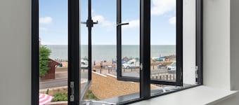 Lovely new home with sea views next to the beach!