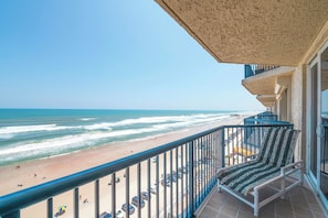 A balcony with a view of the beach and ocean. - 10th Floor Heaven at 1001 Towers 10 3/3 Oceanfront (Daytona Beach Shores)