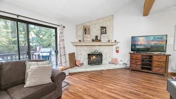 Flat-screen TV, fireplace, table tennis