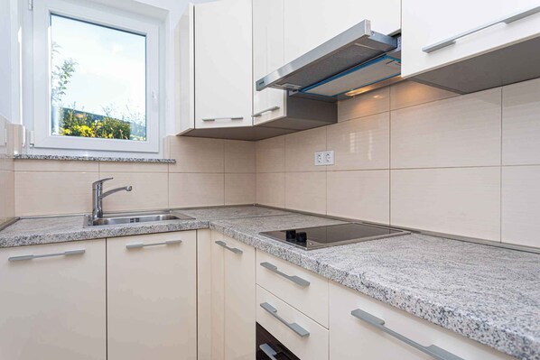 Fridge, microwave, stovetop, coffee/tea maker