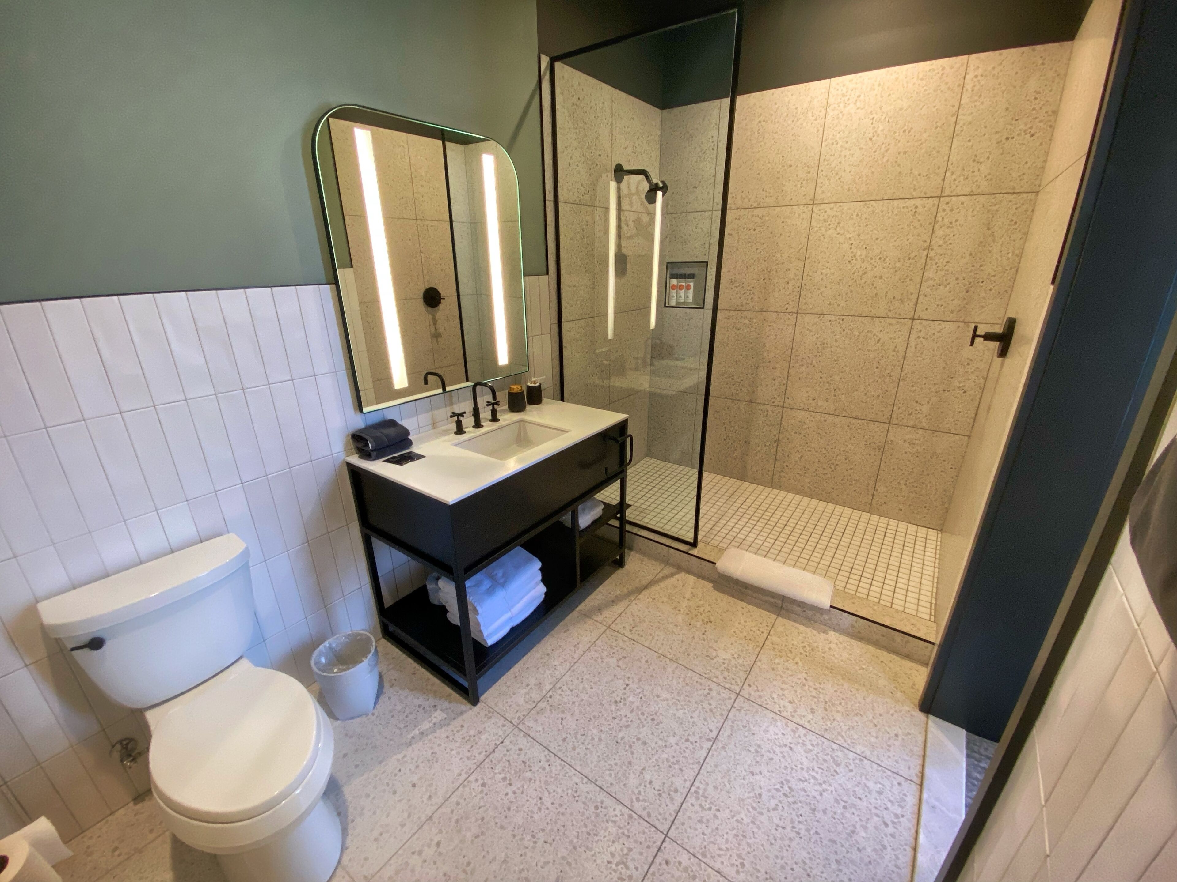 shower, rainfall showerhead, hair dryer, towels