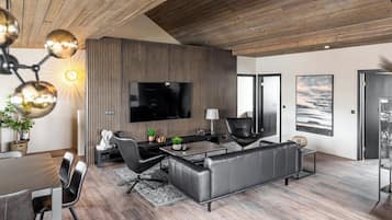 Standard Apartment | Living room | 75-inch Smart TV with digital channels, TV, heated floors