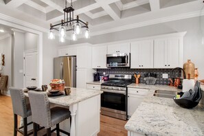 Microwave, dishwasher, coffee/tea maker, cookware/dishes/utensils