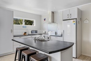 Fridge, microwave, toaster, cookware/dishes/utensils