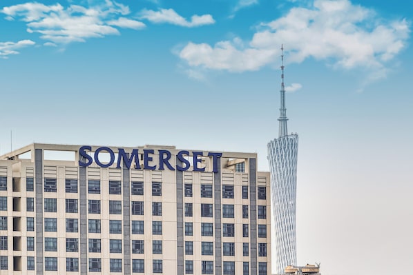 A building with the word "SOMERSET" prominently displayed on its facade. - Somerset Haizhu Centre Guangzhou (Guangzhou)