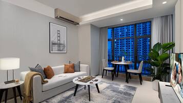 Deluxe Room, 2 Bedrooms | In-room safe, desk, blackout curtains, iron/ironing board