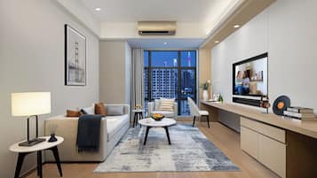 Executive Room, 1 Bedroom | Living room | 55-inch LCD TV with cable channels, TV