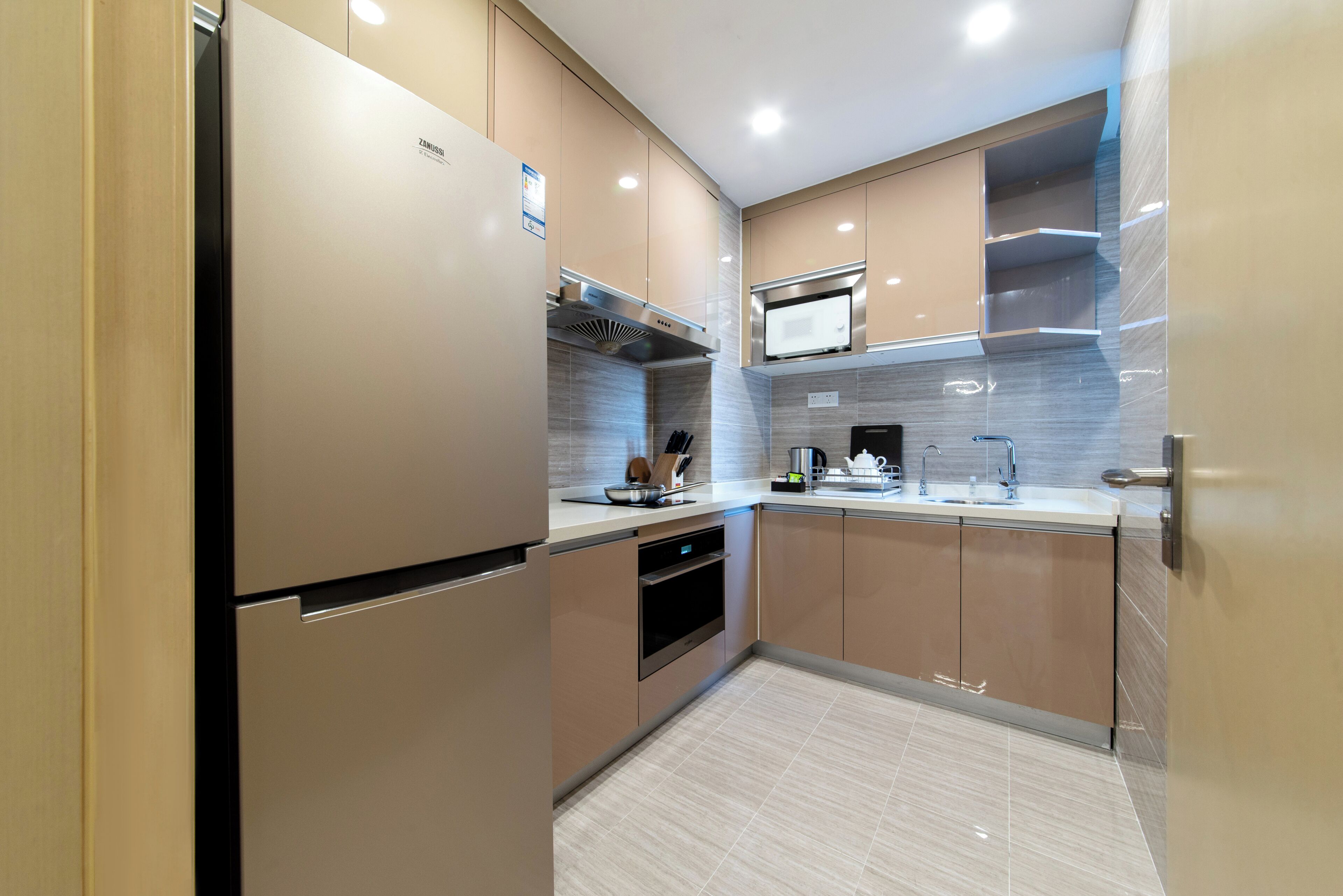 A modern kitchen with stainless steel appliances, a microwave, and a built-in oven.