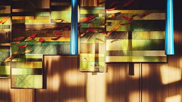 A wall with a geometric pattern and a wooden panel design.