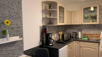 Fridge, coffee/tea maker, electric kettle, toaster