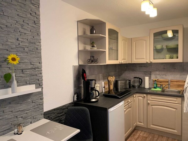 Fridge, coffee/tea maker, electric kettle, toaster