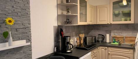 Fridge, coffee/tea maker, electric kettle, toaster