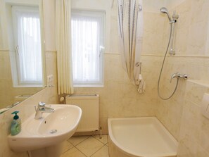Shower, hair dryer, towels, toilet paper