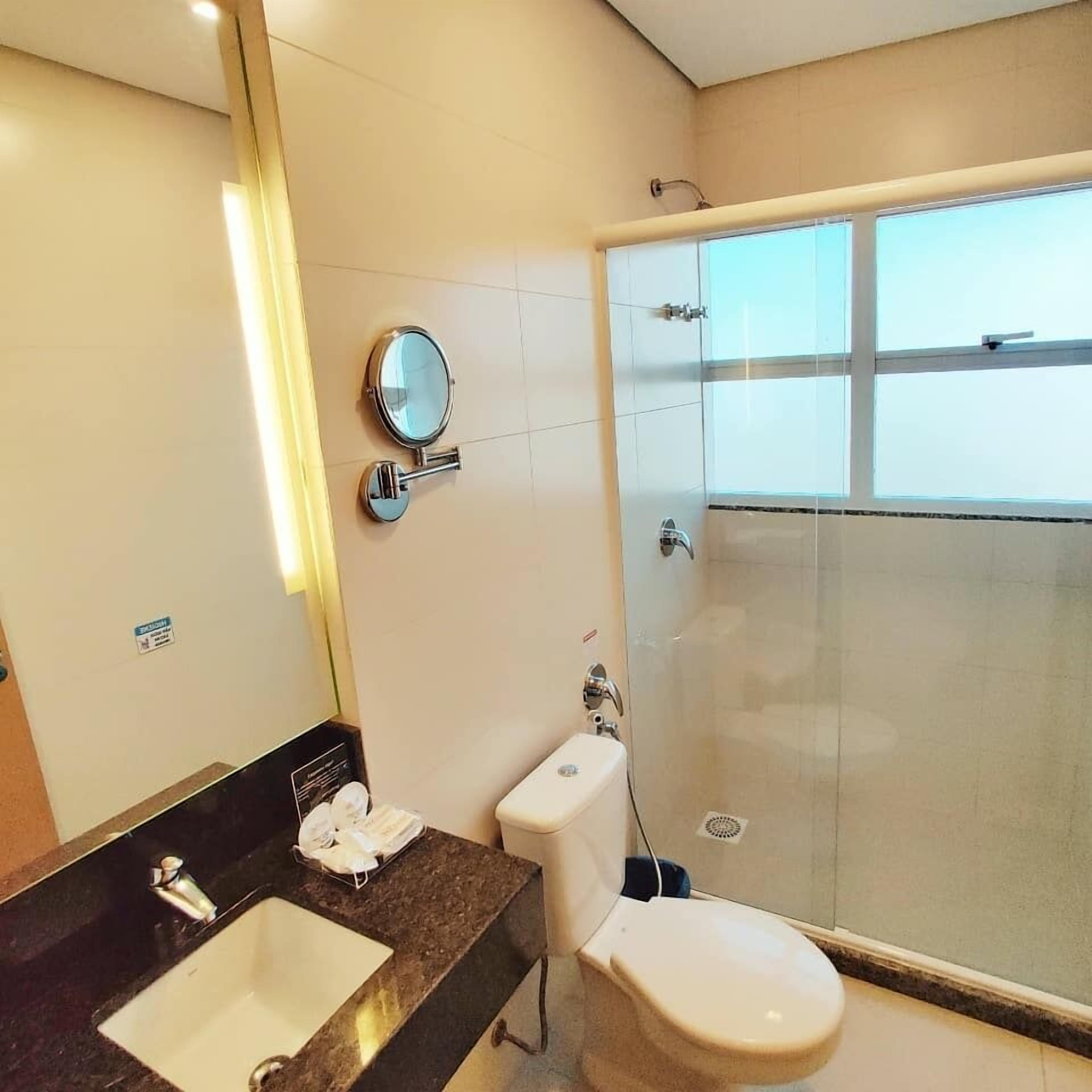 deluxe double or twin room | bathroom | shower, rainfall showerhead, free toiletries, hair dryer