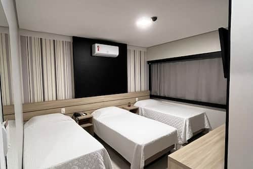 Economy Triple Room | Minibar, desk, laptop workspace, soundproofing