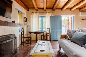 TV, fireplace - Casita Azul: historic and cozy Santa Fé adobe (Santa Fe)