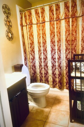 Combined shower/tub, hair dryer, towels, soap
