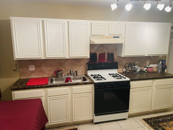 Fridge, microwave, coffee/tea maker, cookware/dishes/utensils