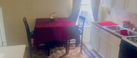 Fridge, microwave, coffee/tea maker, cookware/dishes/utensils