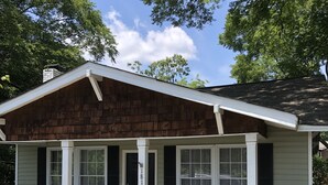 A two-story house with a porch, a chimney, and a mailbox. - 2 BD / 2 BA  (Charlotte)