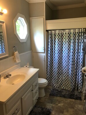 Bathtub, hair dryer, towels, soap