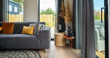 This attractively furnished holiday home with a large terrace, is located on a quiet family park and close to the sea and beach.