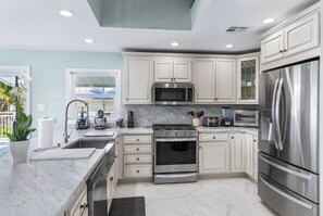 Oven, stovetop, coffee/tea maker, cookware/dishes/utensils