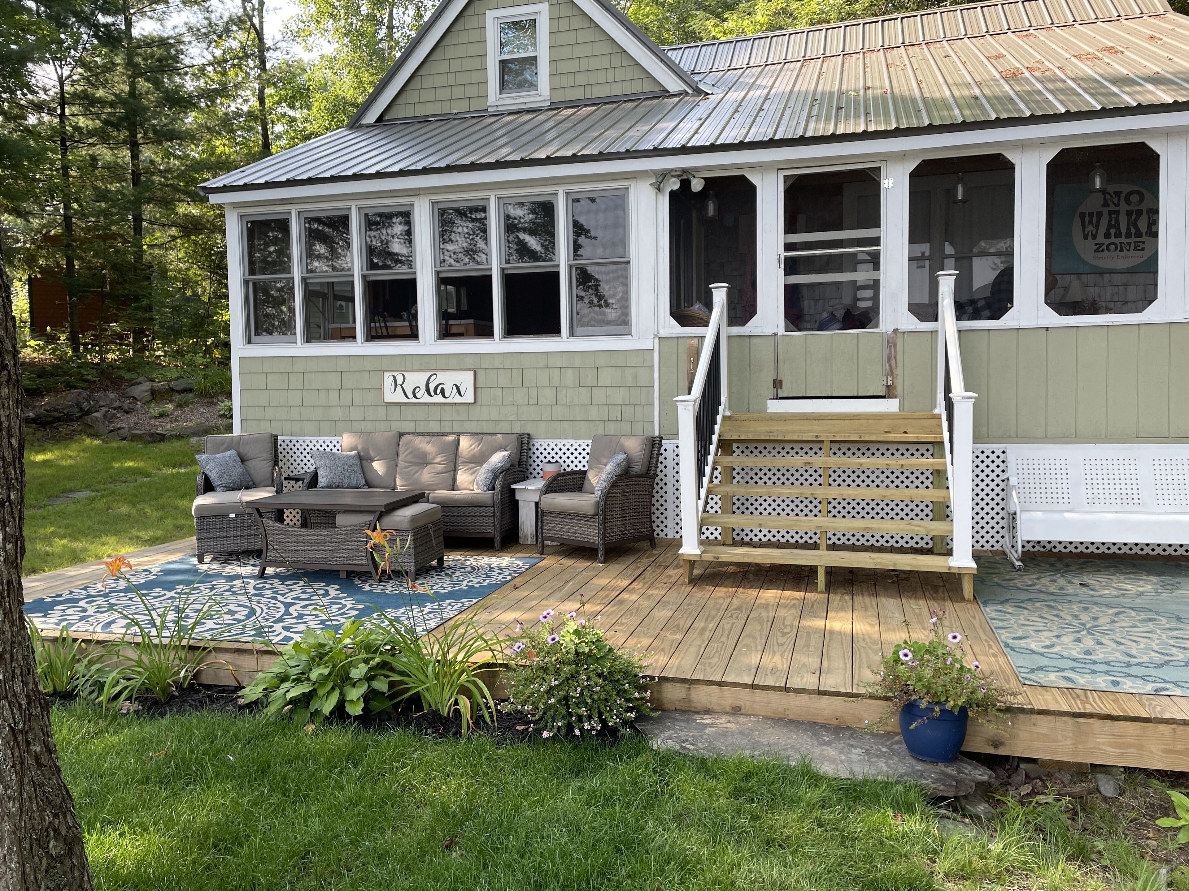 Lakeside camp with private beach, dock and so much more!