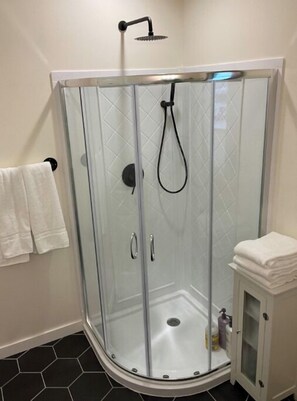 Shower, hair dryer, towels, soap