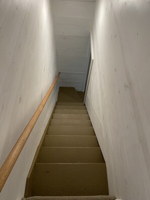 Stairs lead to an upper floor.