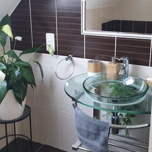 Bathtub, hair dryer, towels, soap