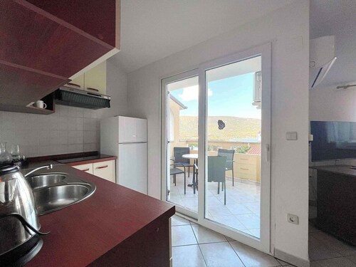 Holiday apartment with balcony and air conditioning