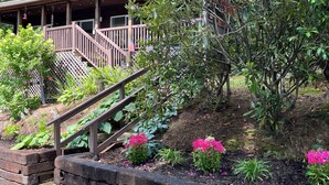 A wooden house with a covered porch and a staircase leading to a deck. - 2 Views!  Front view of Lake Glenville & back view of Christmas Tree farm! (Glenville)