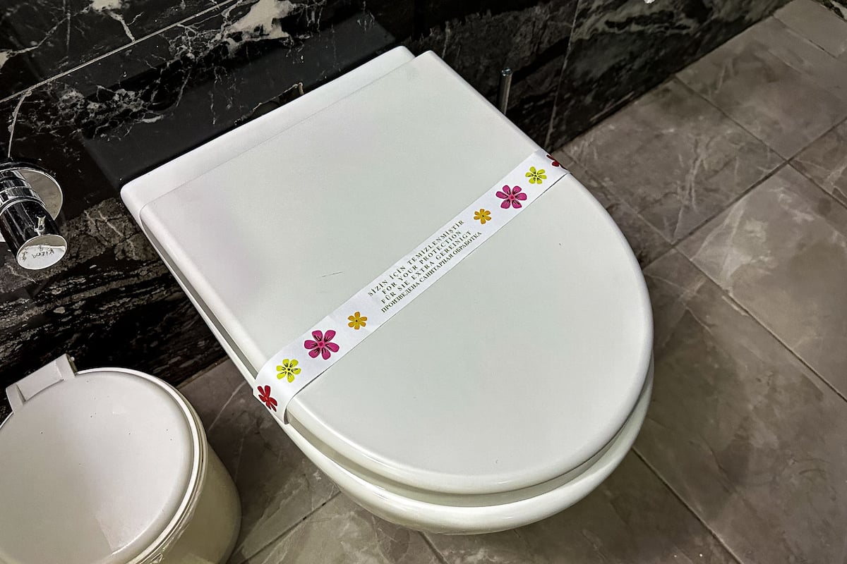 shower, hair dryer, slippers, towels