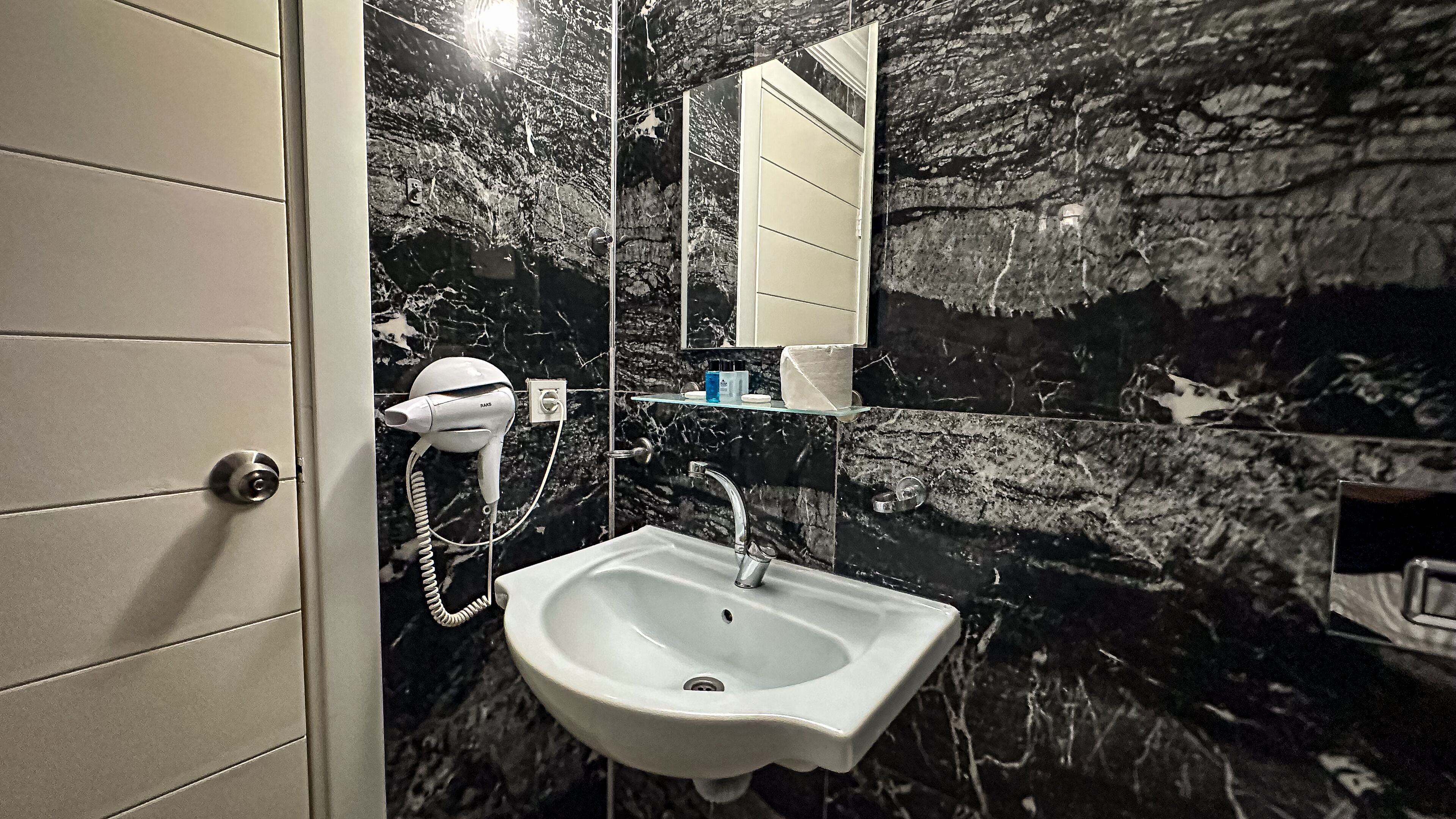 shower, hair dryer, slippers, towels