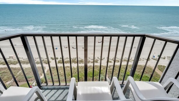 A balcony with a view of the beach and ocean. - Ocean Park Private, Luxurious & Incredible Views (Myrtle Beach)