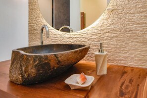 A stone sink with a modern faucet and a soap dish on a wooden countertop. - Discover Athens from an Upscale flat in Koukaki! (Αθήνα)