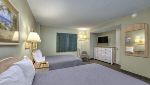 A hotel room with two beds, a desk, a chair, a dresser, a television, and a large window with a view of palm trees. - SAND DUNES SOUTH TOWER 1150 AND 1149 (Myrtle Beach)