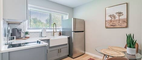 Fridge, microwave, stovetop, coffee/tea maker