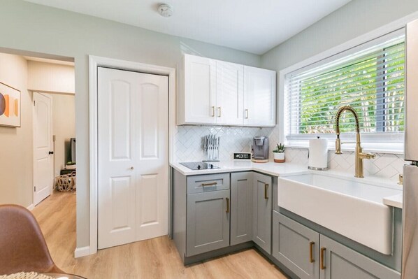 Fridge, microwave, stovetop, coffee/tea maker