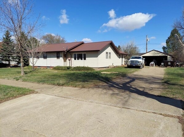 Stylish single-story home with a front porch and garage.
