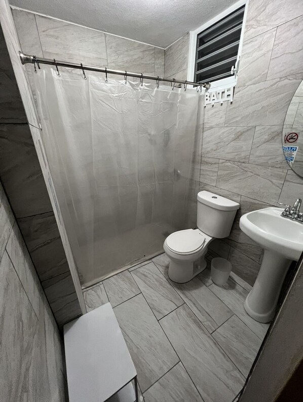 Shower, hair dryer, towels, soap