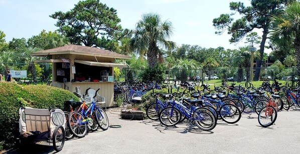 A bike rental station with a small kiosk and a row of bicycles. - Ocean View, Pool, Tennis, Pickleball, Seasonal Music (Hilton Head Island)