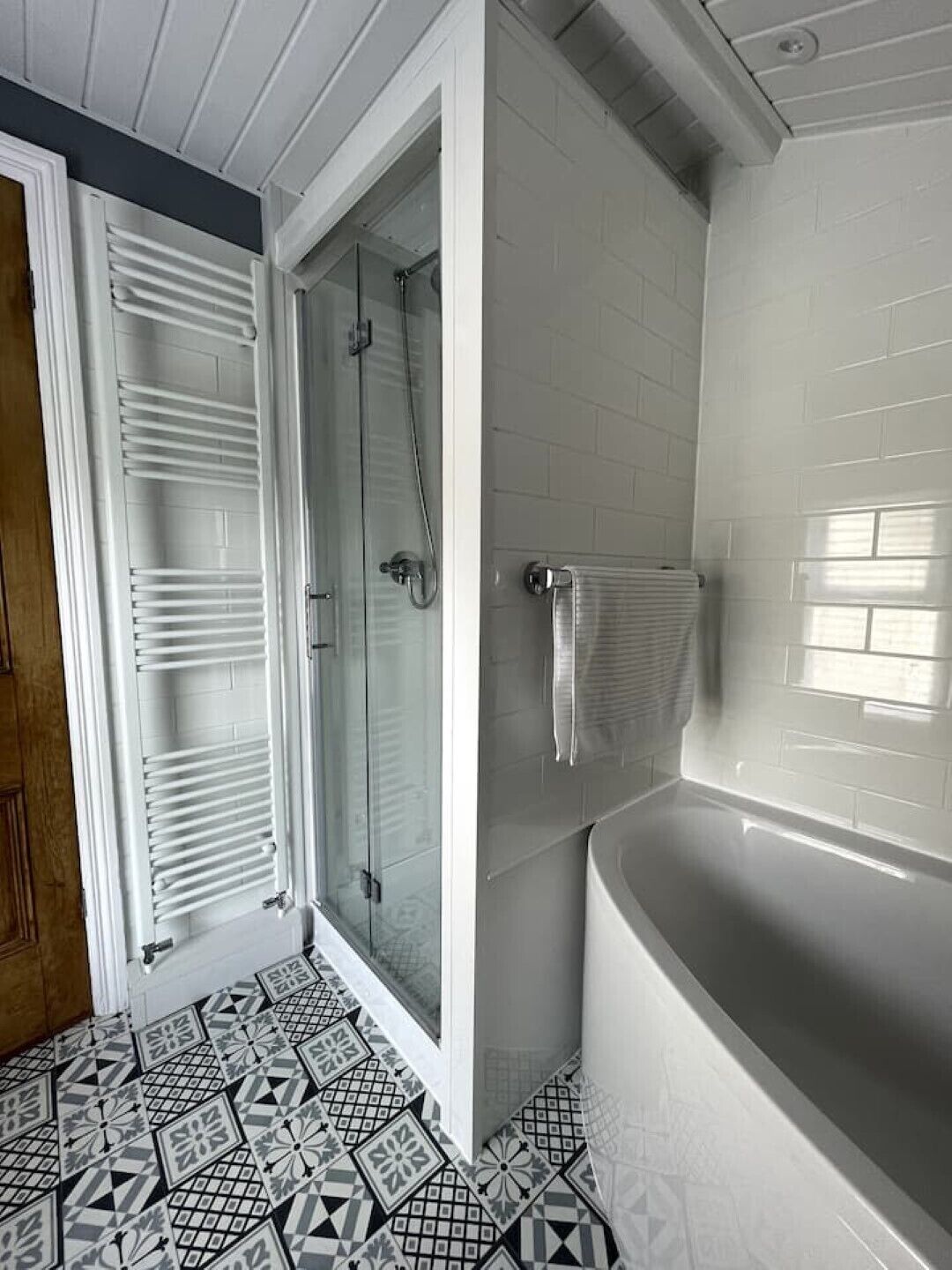 Bathtub, towels, toilet paper