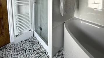 Bathtub, towels, toilet paper