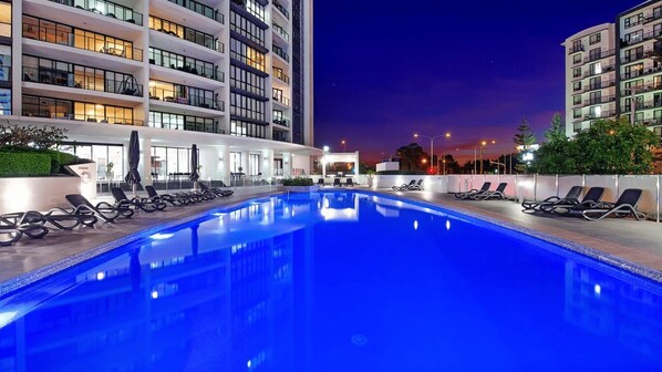 Relax by the pool surrounded by comfortable lounge chairs and take in the views from the spacious balconies.